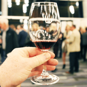 Wine Glass and Festival Crowds